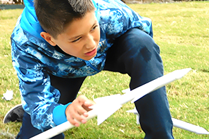 Boy aiming his rocket