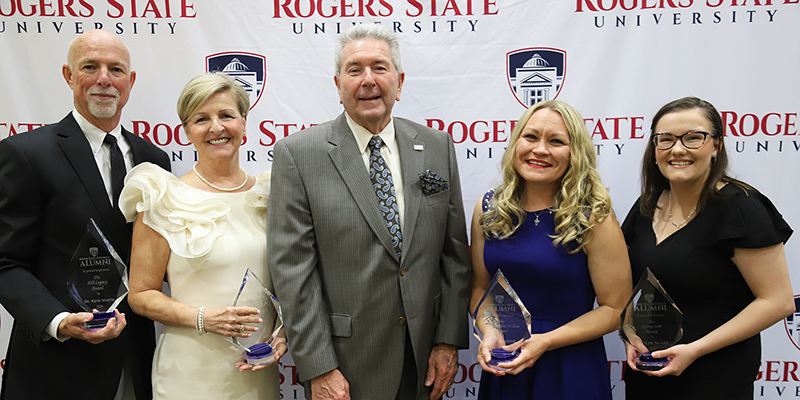 Rogers State University President Dr. Larry Rice (center) congratulates 2024 Distinguished Alumni honorees Dr. Keith and Lisa Martin (from left), Hillcat Legacy Award recipients; Jody Moore, Distinguished Hillcat Award recipient; and Caitlyn Ngare, Rising Star Award recipient.