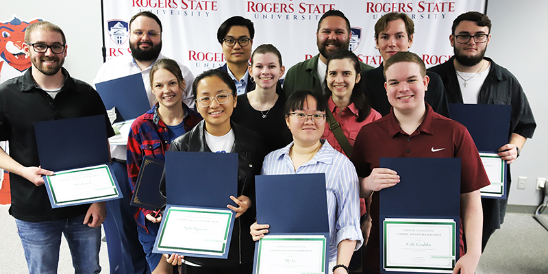 Rogers State University’s cybersecurity team members were recognized recently for their exemplary season, with Team A finishing in the top one percent and Team B finishing in the top four percent. Honorees included Nghi Nguyen of Vietnam (front, from left), My Le of Vietnam, and Colt Grubbs of Claremore; Alex Laird of Claremore (center, from left), Courtney Townsend of Tulsa, Alyssa Allen of Claremore, and Sarah Karamitis of Claremore; and JamesDake Meilvane of Claremore(back, from left), Khai Nguyne of Vietnam, Ted Watson of Tulsa, Sayre Bennett of Talala, and Reece Dodson of Pryor.