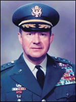 White male wearing a military uniform with many badges
