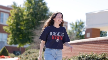 Female RSU student walking on campus