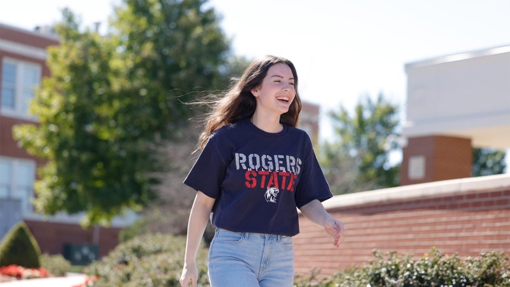 Female RSU student walking on campus