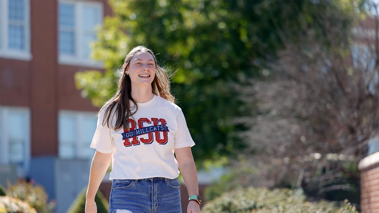 Female RSU student walking on campus