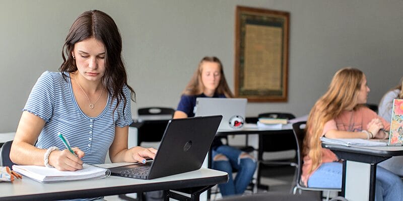 GirlTakeNotesLaptopClass Header