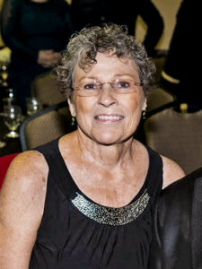 Smiling woman wearing a black tank top