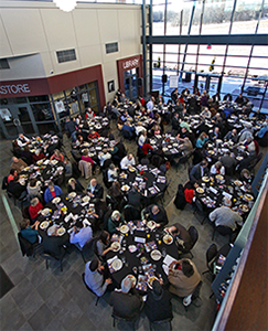 Attendees eating at the Pryor Breakfast