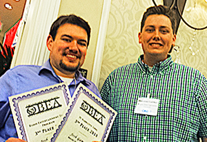 Josh Gammon and Houston Gaither pose with awards.