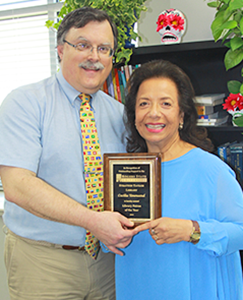 Alan Lawless and Cecelia Townsend pose with award.