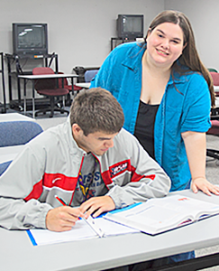 Student tutoring another student.