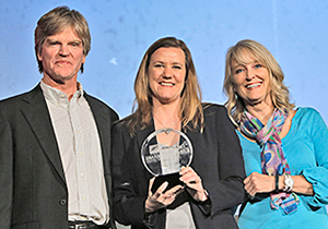 Rogers State University senior Samantha Slater, center, received the competitive Oklahoma Business Roundtable Paulsen Award during the recent Donald W. Reynolds Governor's Cup business plan competition. Presenting the award are Doug Paulsen and Kathie Paulsen, the children of the award's namesake. 