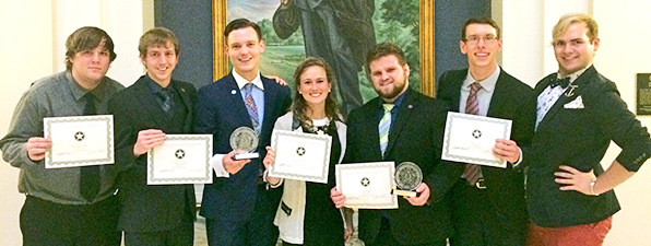 Members of the RSU OIL team holding their awards.