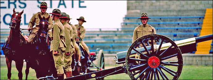 Soldiers practicing with a cannon.