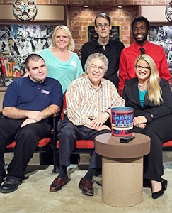 RSU SBA students get their picture taken on the set of OETA's Movie Club with host BJ Wexler following the day-long OETA-TV Student Day.