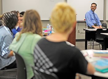 Dr. James Ford teaching students in classroom