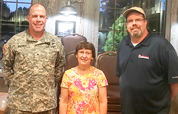 Commandant and Brigadier General James Raymer standing with RSU Professors Jane Johansson and David Ulbrich. 