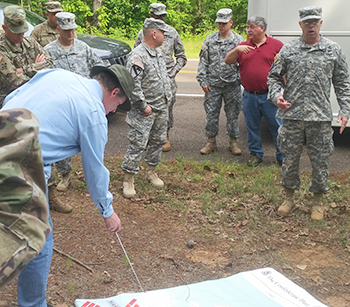 RSU Professor Paul Hatley points to a portion of the battlefield map while Brigadier General James Raymer (on far right) explains the relevance of Shiloh to today’s Army.