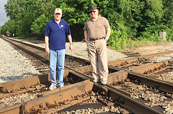 RSU Professor Paul Hatley (left) and British Army veteran Jim Carrick stand at the railroad crossroad in nearby Corinth, Mississippi.  The Battle of Shiloh was fought to control this key objective.