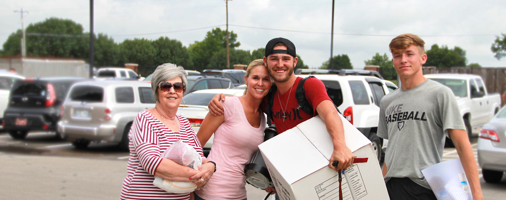 Boy with his family on move in day