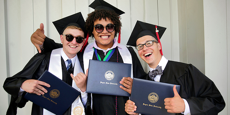 Boys laughing with diplomas