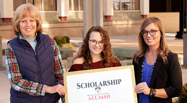 Karen Lowe-Alton (left) presents the scholarship award to Jaycee Brake (center) along with Stephanie Dingman (right).
