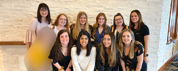 group of girls posing for picture