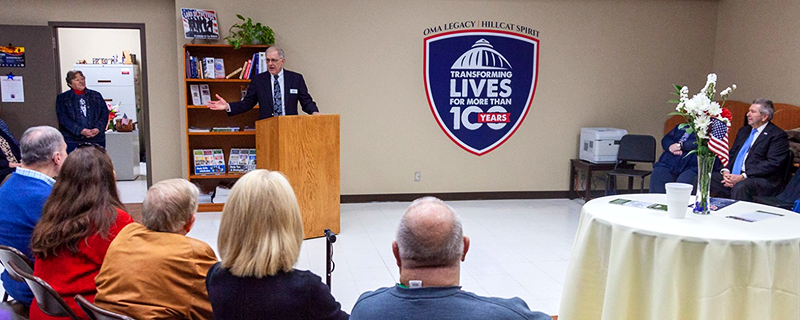 speaker at podium with audience