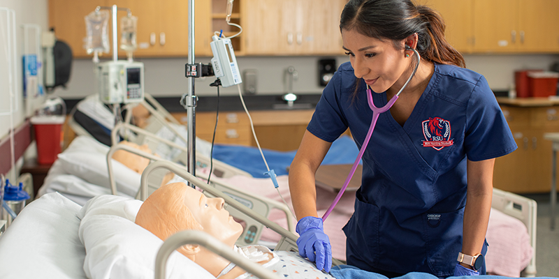 student nurse listening to heart