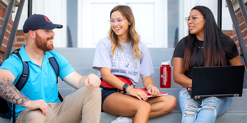 Students sitting and talking on steps