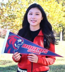 girl holding RSU pennant