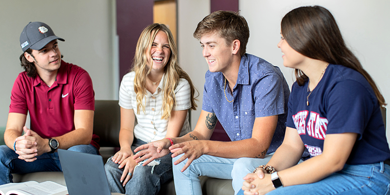 students laughing in rec room