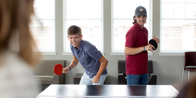 students playing ping pong