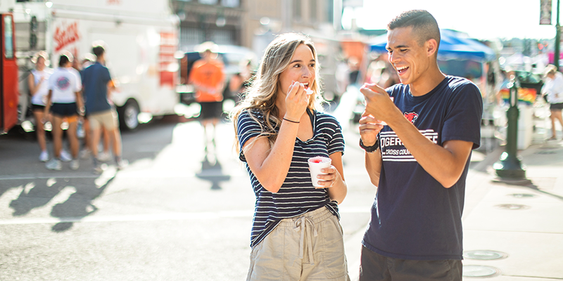 boy and girl eating snow cones