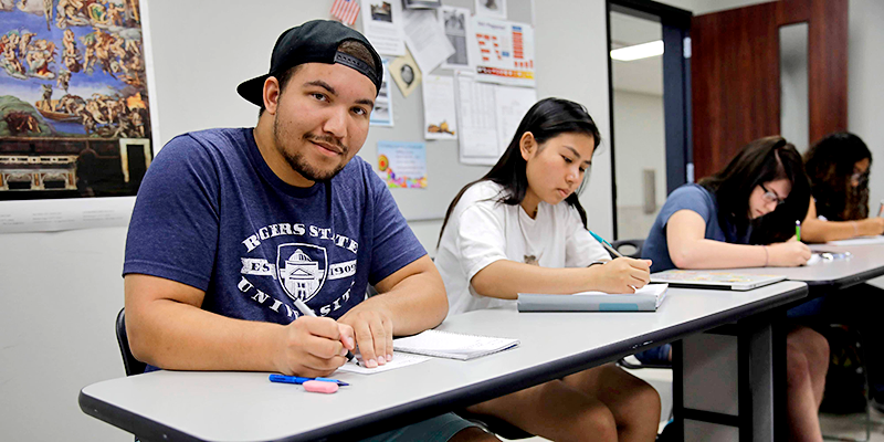 students writing notes in class