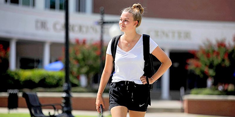 girl walking with hand on hip