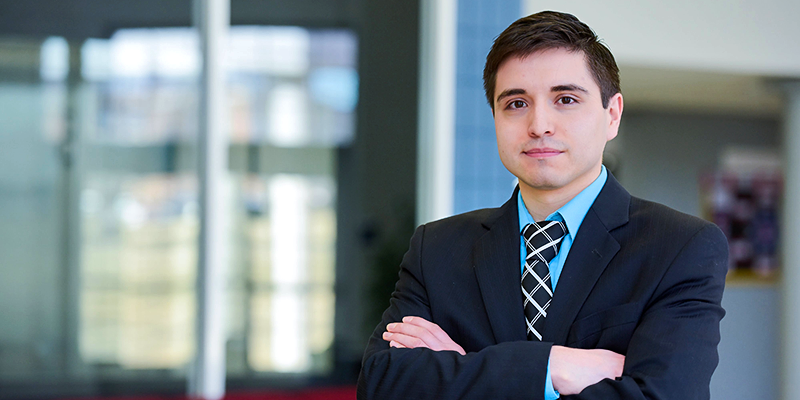 boy in suit with arms crossed