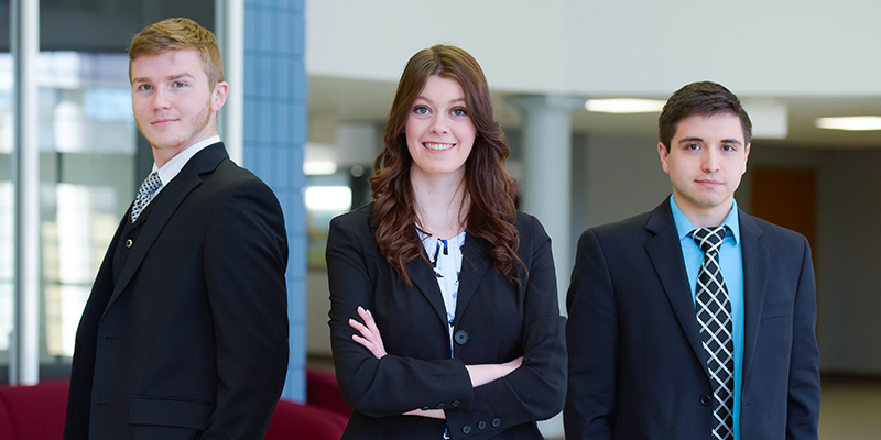 girl and 2 boys wearing professional dress suits