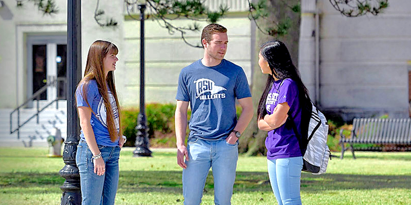 students talking outside