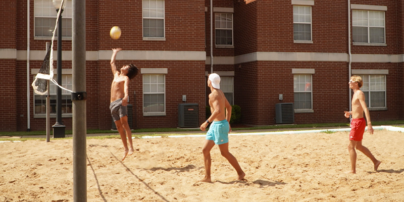 boys playing volleyball