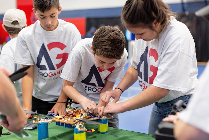 students working on a drone