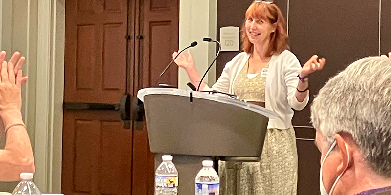 Dr. Holly Kruse speaking at podium