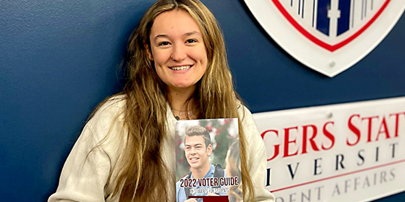 girl holding brochure