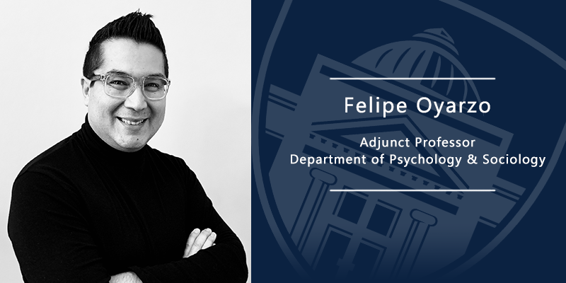 Felipe Oyarzo smiling with arms crossed