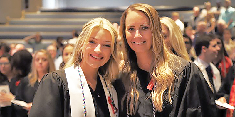 graduates smiling