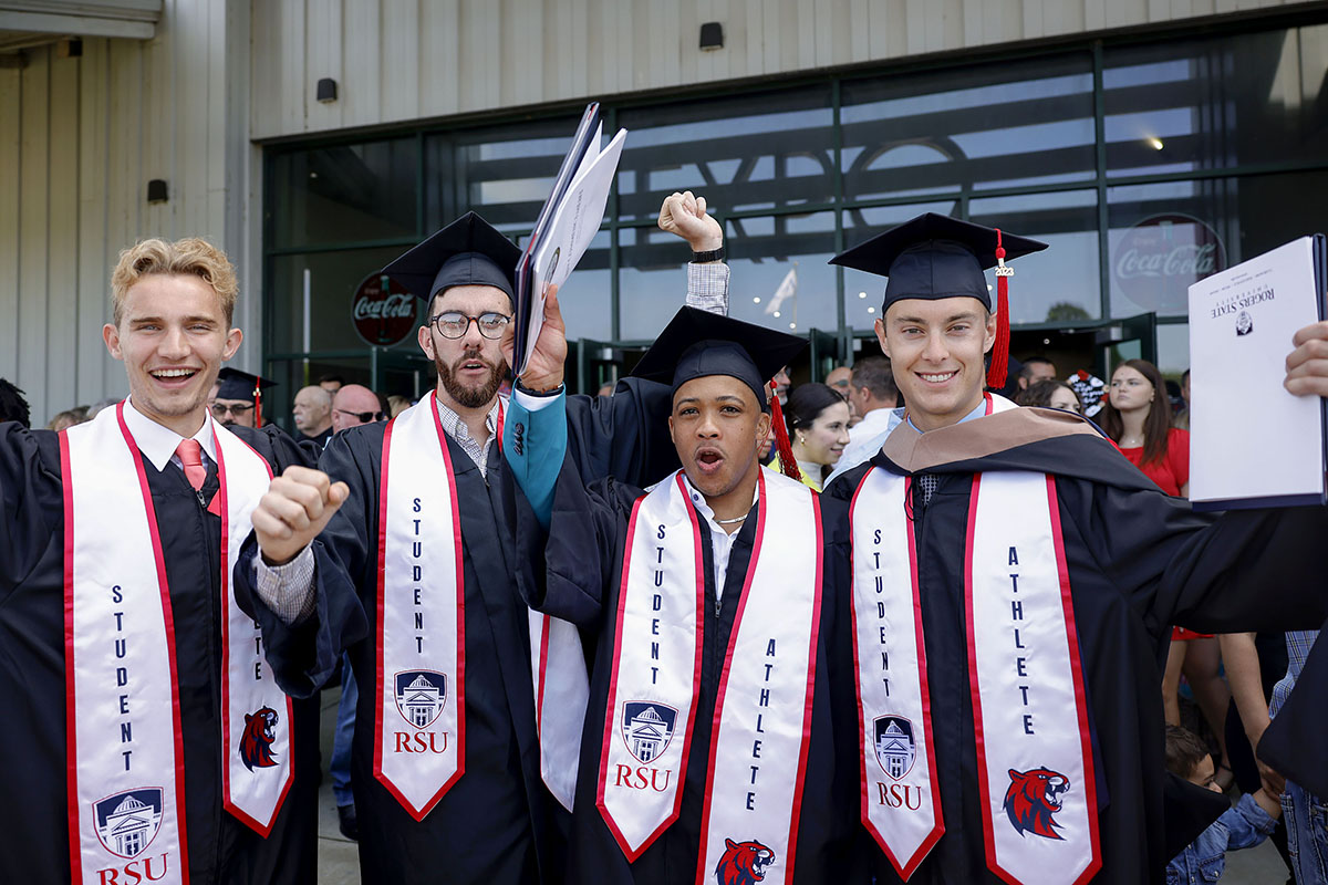 boys cheering at graduation