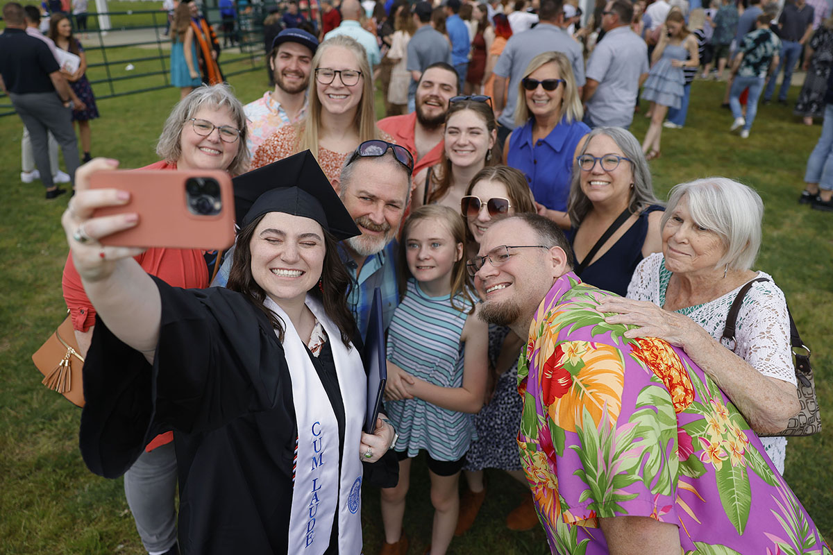 group taking a selfie at graduation