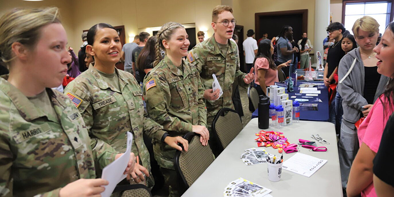 Students vising booths at a college fair