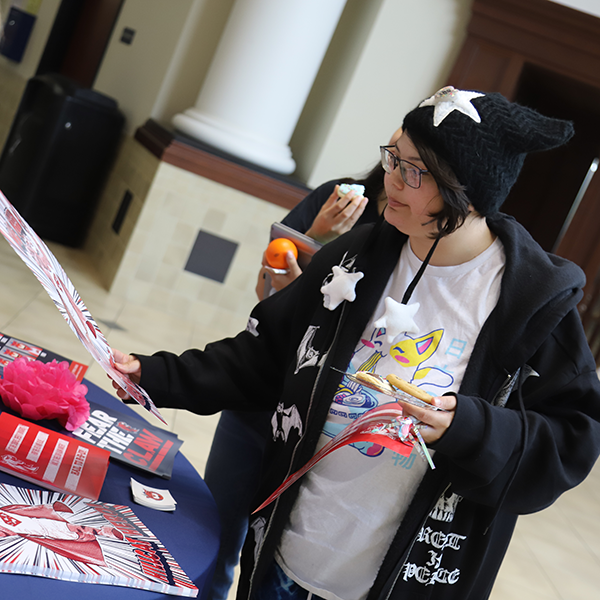 girl looking at poster