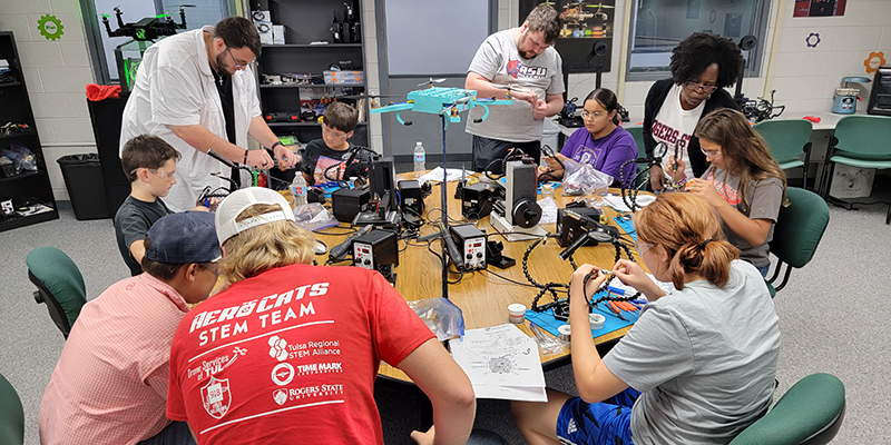 Elementary students learning about and building drones