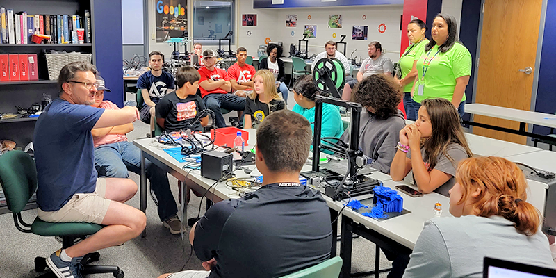 Elementary students learning about and building drones