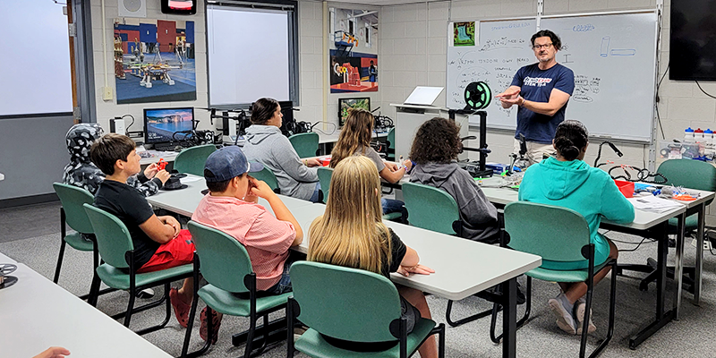 Elementary students learning about and building drones